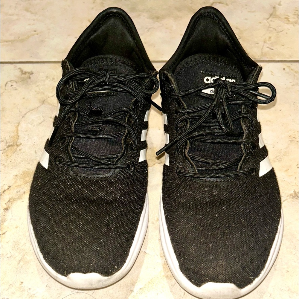 Woman’s Adidas Core Black and White Athletic Shoes
